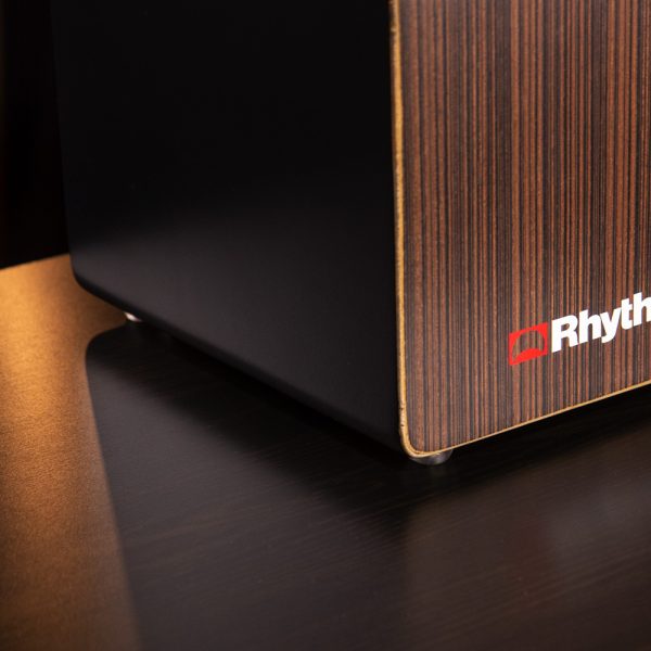 closeup of front right corner of Rhythm Tech cajon on wooden table